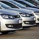 Row of parked vehicles viewed from the front.